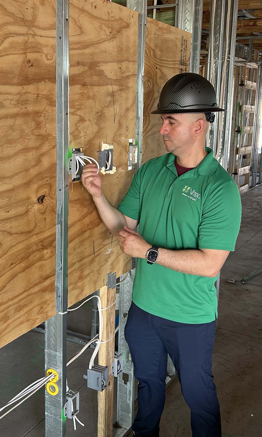 TV location pre-wire installation in home framing with mud rings and back boxes
